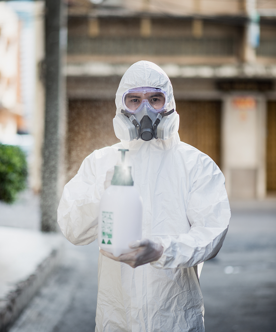 Pest control technician in protective gear